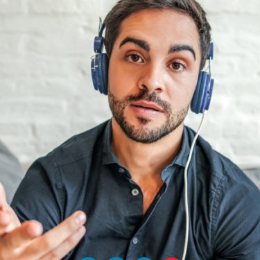 A man is wearing headphone and try to showing he want to talk to you.
